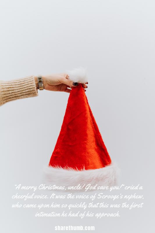 A lady hold santa cap from top on white